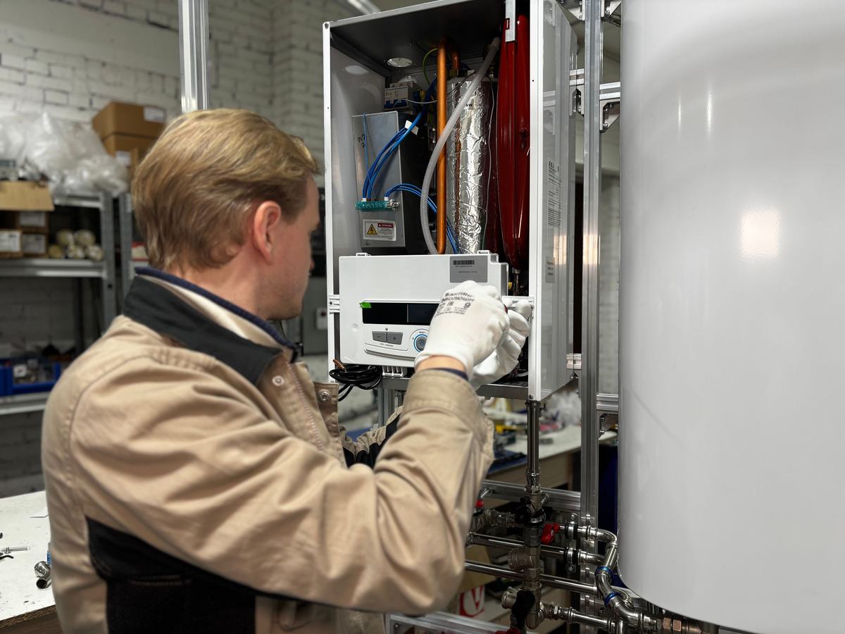 Boiler repair in Mississauga technician servicing a wall-mounted boiler